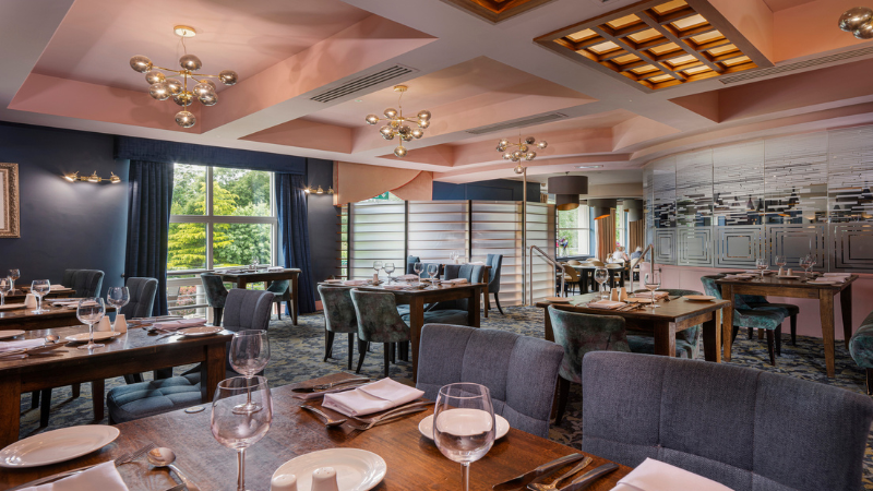 The dining room in the Four Seasons Hotel Carlingford is pink with statement lighting.